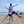 Load image into Gallery viewer, Child in a Humu Juniors Classic Long-Sleeve Rash Guard with their dad wearing a white Humu long-sleeve performance sun shirt on the beach
