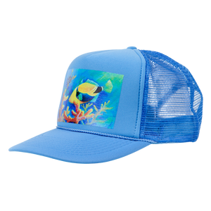 Three-quarter view of the blue Humu Lanai Trucker Hat showing tropical fish artwork and blue mesh back