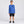 Load image into Gallery viewer, Smiling boy wearing the Humu Maui Ocean Blue Kids Long Sleeve Rash Guard with chest fish logo and Hawaiian sleeve lettering
