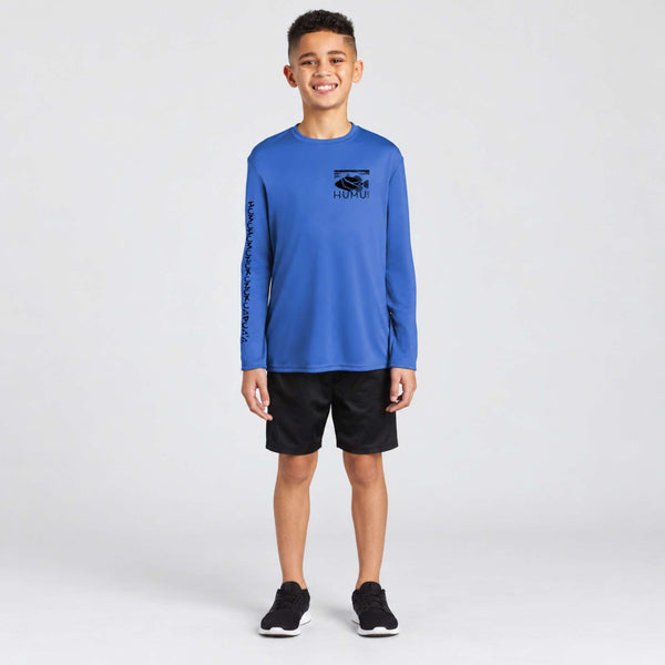 Smiling boy wearing the Humu Maui Ocean Blue Kids Long Sleeve Rash Guard with chest fish logo and Hawaiian sleeve lettering