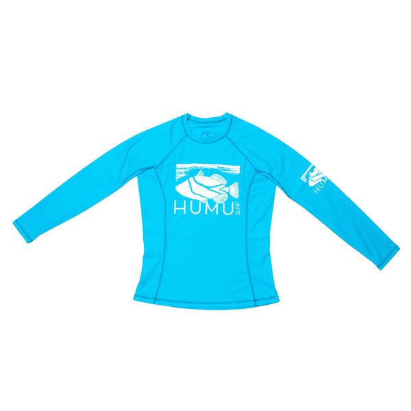 Full front view of the Hawaii Blue Humu Women's Wahine Kore-Dry Long Sleeve Rashguard with sleeves extended, showing the fish graphics and seam construction