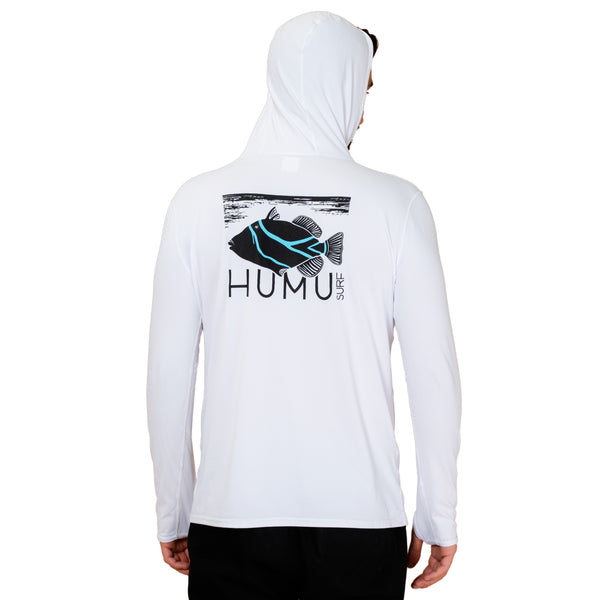 Back view of a man wearing the white Humu Men's Woody Long Sleeve Performance Hoody with hood up and large black and turquoise Humu Surf fish artwork
