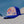 Load image into Gallery viewer, Humu Napili Trucker Hat with colorful fish artwork photographed beside the ocean
