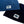 Load image into Gallery viewer, Close-up of Navy and Surf Blue Humu Surf Beanies showing the embroidered fish logo patches
